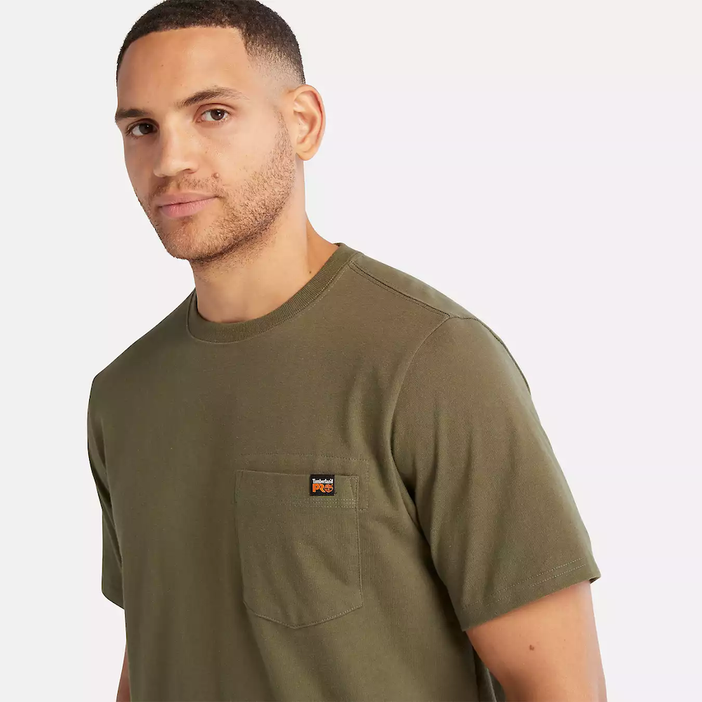 Olive Timberland PRO Core Pocket T-Shirt for Men. Cotton blend fabric for comfort and breathability. Reinforced stitching for durability. Classic crewneck silhouette. Chest pocket for utility. Machine washable.