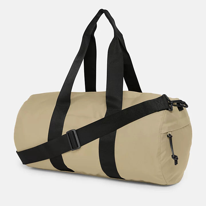 Beige TimberlandÃƒâ€šÃ‚Â® Timberpack Duffel Bag. High-quality materials for durability. Spacious main compartment for storage. Interior pockets for organization. Comfortable carrying straps for versatility. Beige color for neutral style. Ideal for weekend getaways, overnight trips, carry-on luggage, everyday errands, gym visits, or sporting activities.