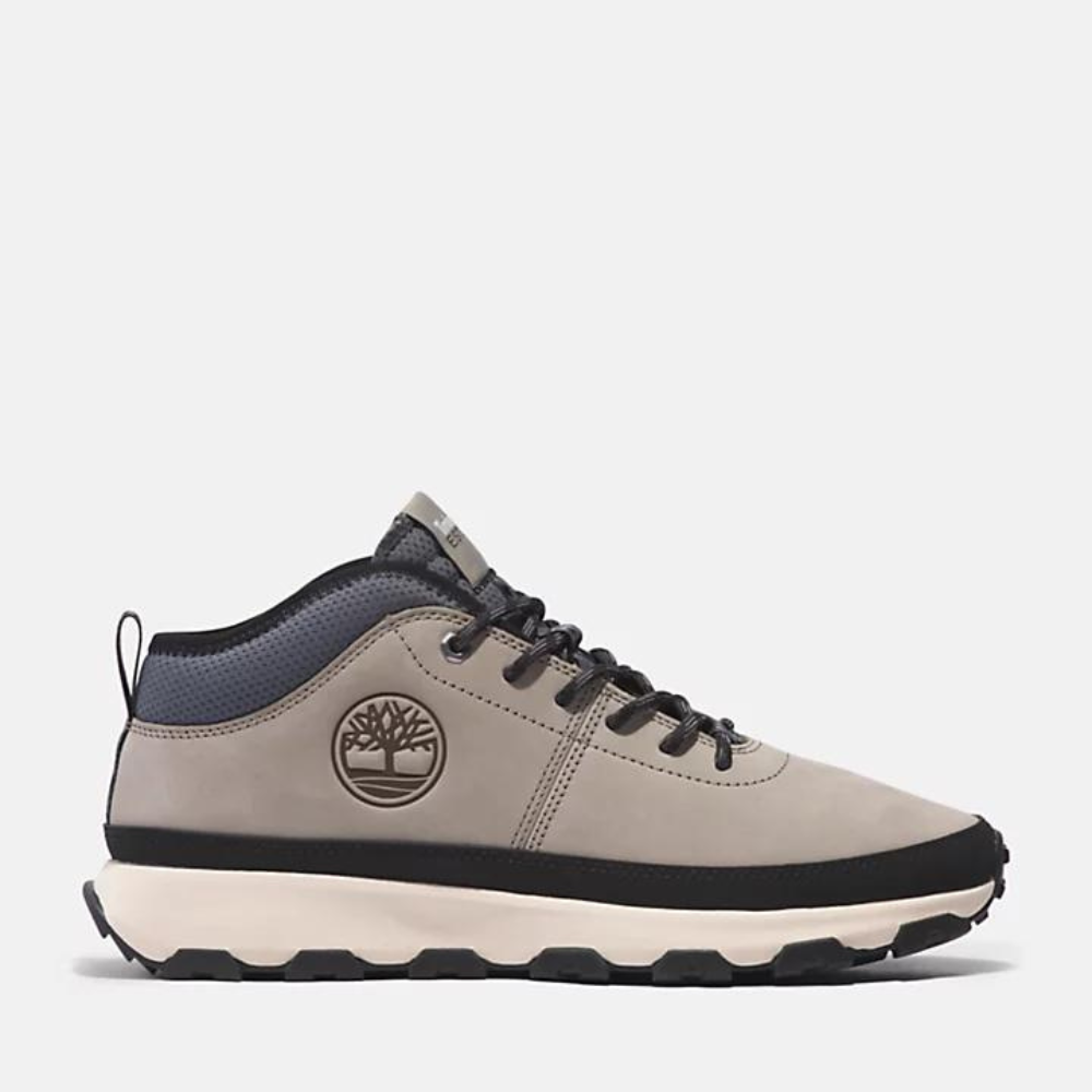 Light Taupe Timberland® Winsor Trail Leather Trainer for Men. Premium leather and ReBOTL™ fabric upper for durability and eco-consciousness. High-grip outsole for traction. GreenStride™ foam midsole made with bio-based materials for comfort. Escape the ordinary with this outdoor-inspired trainer.