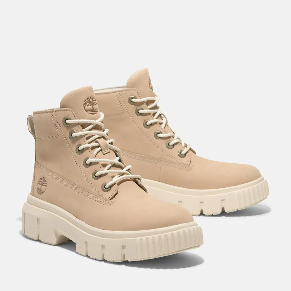 Timberland Greyfield Mid Lace-Up Boot for Women. Leather boot with lace-up closure, ReBOTL lining, and comfortable cushioning.  Versatile for casual wear and urban exploring.